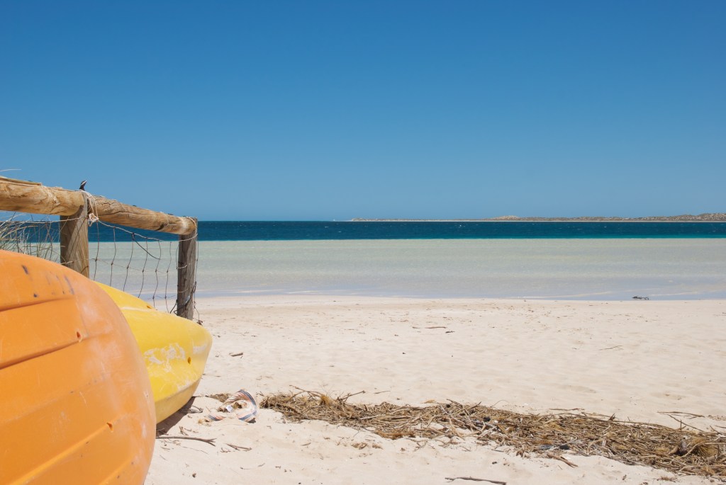 Kayaks and blue skies. Coral Bay, Western Australia