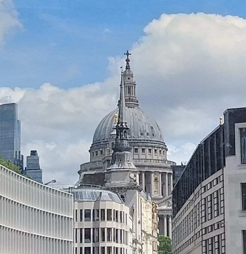 Dome of St Paul's among buildings squashed together