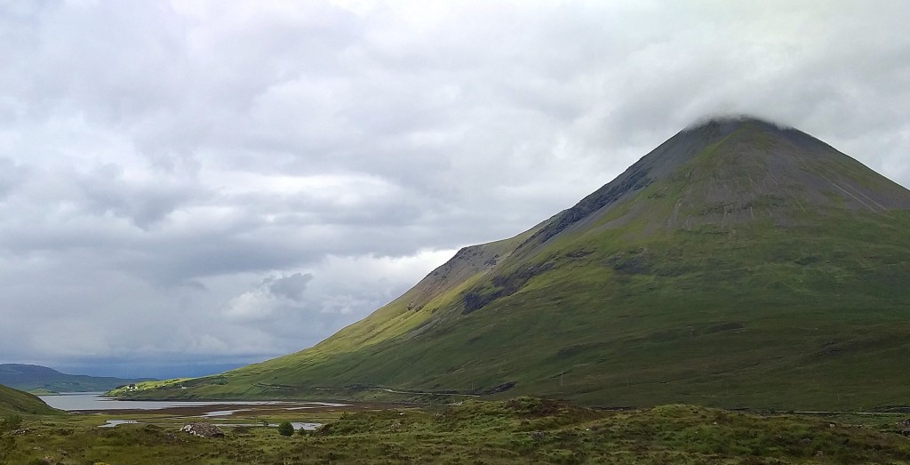 The Isle of Skye. Great volcanic plugs tower over flat valleys